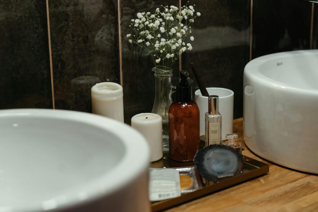 A stylish arrangement of skincare products and candles in a modern bathroom setting, perfect for self-care ambiance.